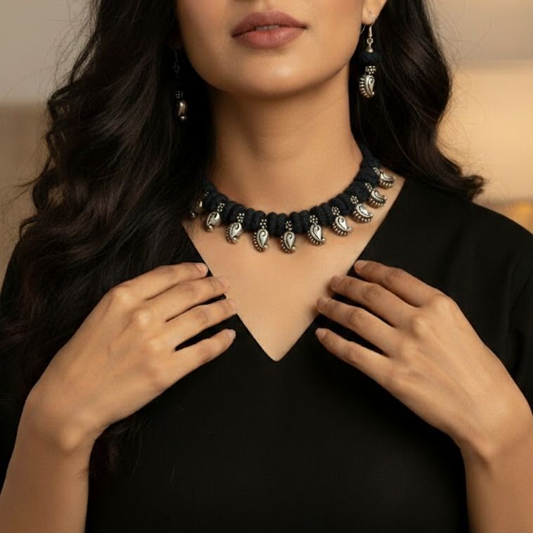 Desi Threads: Black Thread Bead and Silver Mango Motif Necklace and Earring