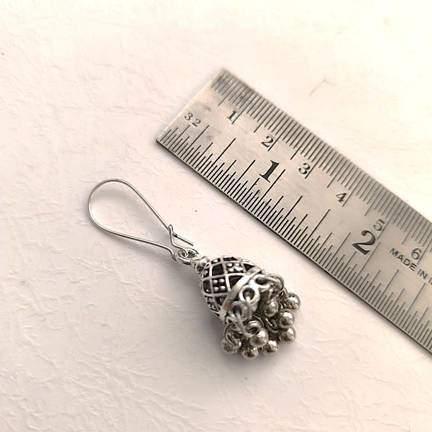 Vaibhava: Silver Toned Carved Hasli Set with Jhumkas