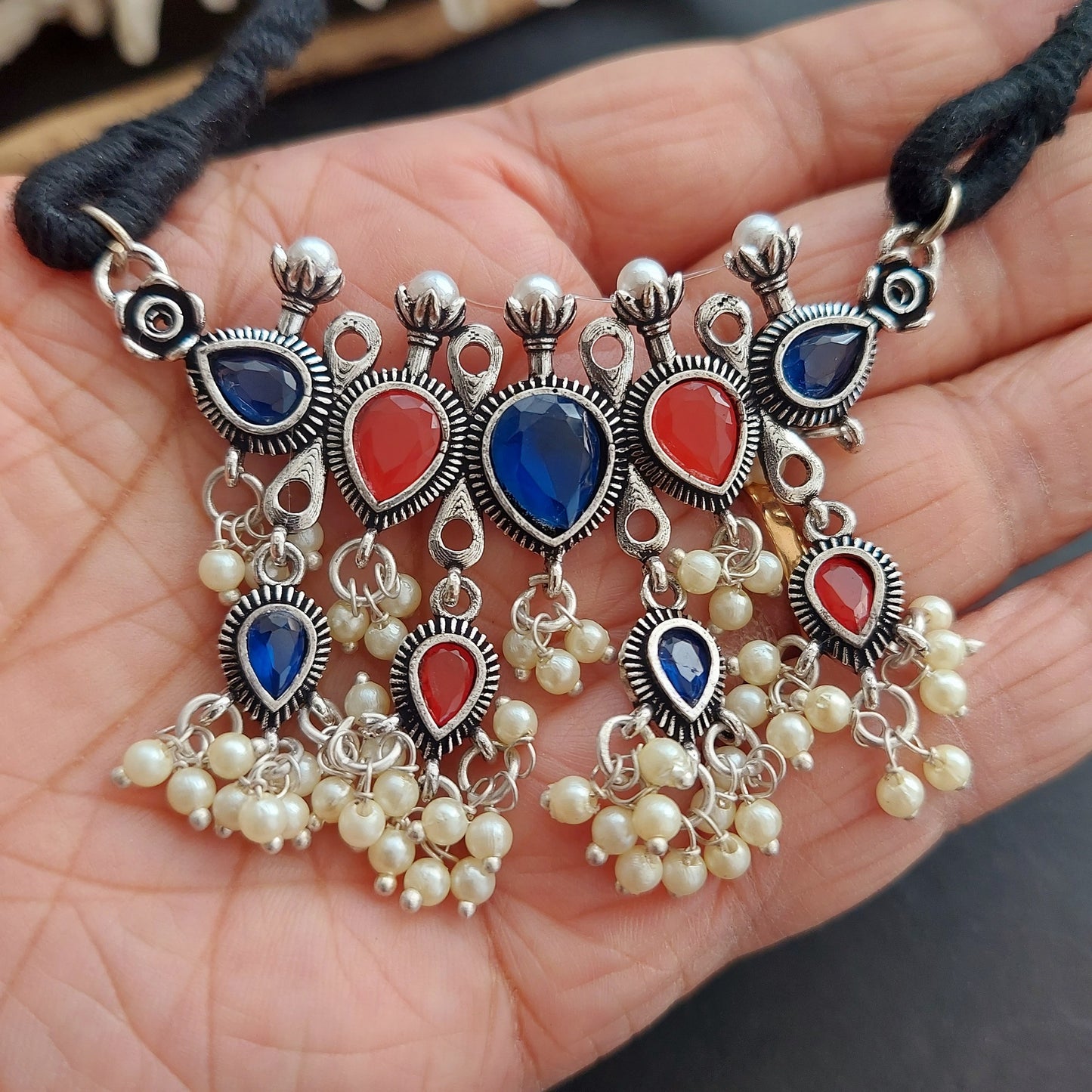 Silver Look alike Stone Studded Threaded Choker Set with Pearls Danglers - Red and Blue