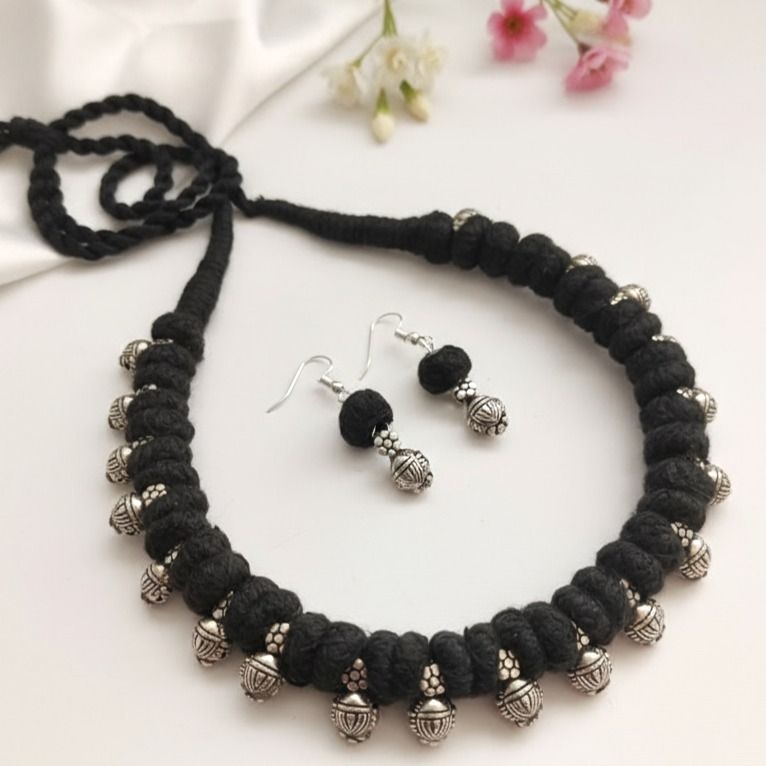 Desi Threads: Black Thread Bead and Silver Bead Motif Necklace and Earring