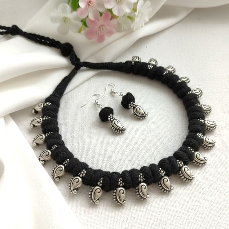 Desi Threads: Black Thread Bead and Silver Mango Motif Necklace and Earring