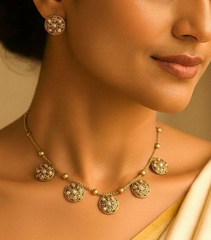 Chandrika: Gold Toned Pearl Necklace and Earring Set