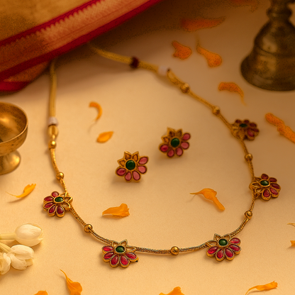 Ira: Gold Toned Floral Stoned Studded Necklace and Earring Set