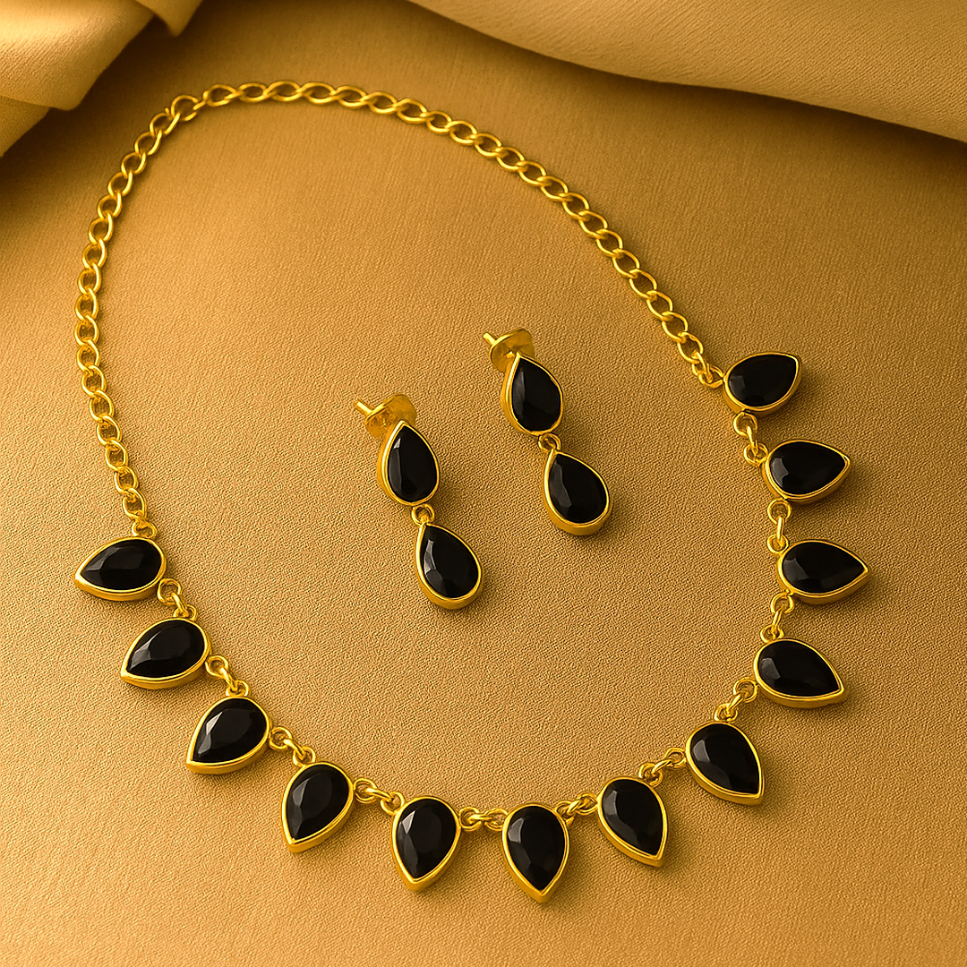 Nishka: Gold Toned Black Stone Necklace and Earring Set