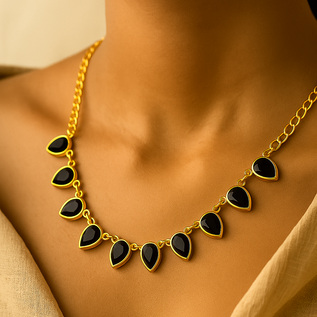 Nishka: Gold Toned Black Stone Necklace and Earring Set