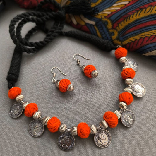 Amber Essence: Coin and Orange Thread Bead Silver Tone Necklace