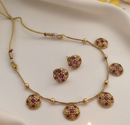 Chandrika: Gold Toned Pink Stoned Studded Necklace and Earring Set