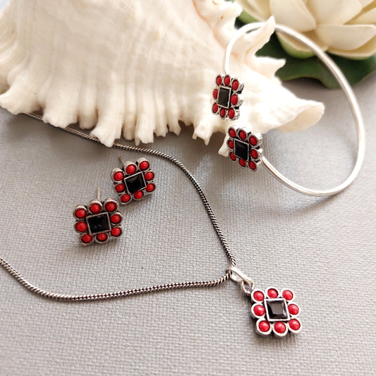 Coral Onyx Delight: Coral Red and Black Stone Pendant Earring and Bracelet Set in Silver Tone