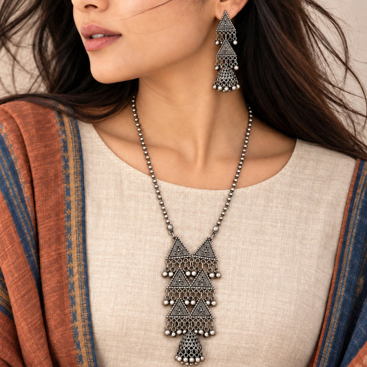 Dhrithi: Oxidized Festive Necklace and Earring Set