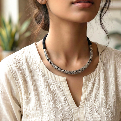 Vaibhava: Silver Toned Carved Hasli Set with Jhumkas