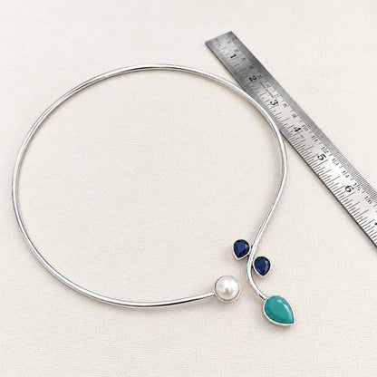 Rajata : Silver Toned Hasli with Pearl , Teal, and Deep Blue Stones