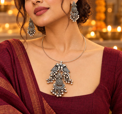 Mayura: Silver Toned Hasli Set With Pendant and Earring Set