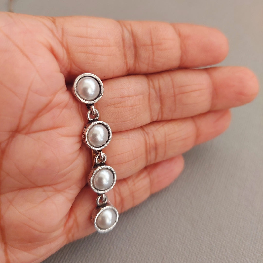 Pearl Charisma: Oxidized Four-Pearl Dangler Earrings