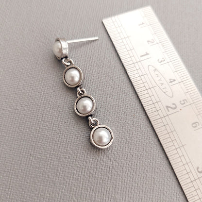 Pearl Charisma: Oxidized Four-Pearl Dangler Earrings