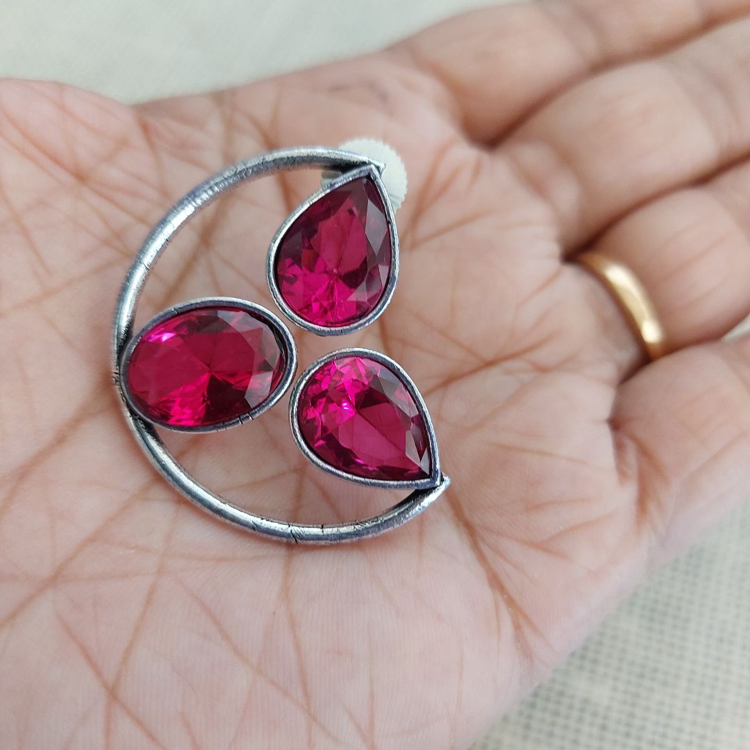 Radiant Pink Glamour: Silver-Toned Ear Studs Adorned with Bright Pink Stones