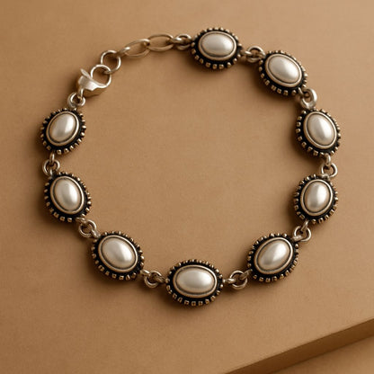 Aashirs Bestseller Combo: Moonmist Pendant and Earring Set/ Classic Pearl Link Bracelet