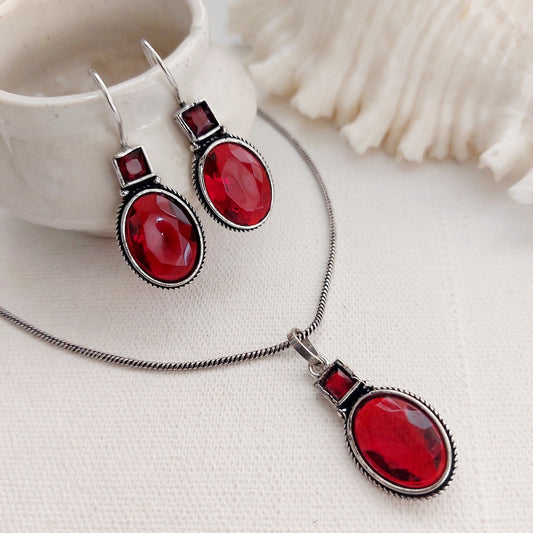 Ruby Glow: Silver Toned Pendant and Earring Set