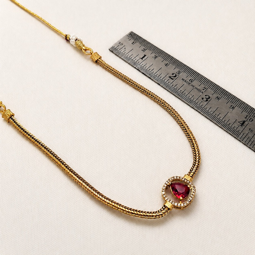 Aabha: Minamalist Ruby Stone Gold Toned Necklace and Earring Set