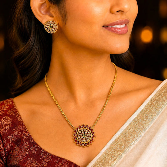 Aarunya: Gold Toned Festive Pendant and Earring Set