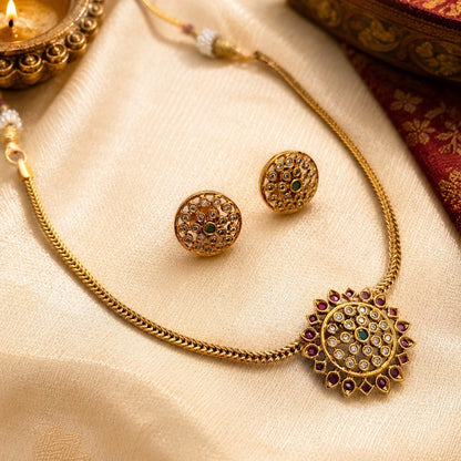 Aarunya: Gold Toned Festive Pendant and Earring Set