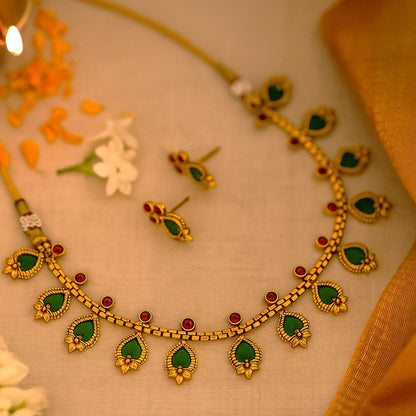 Kanaka: Gold Toned Stone Studded Necklace and Earring Set
