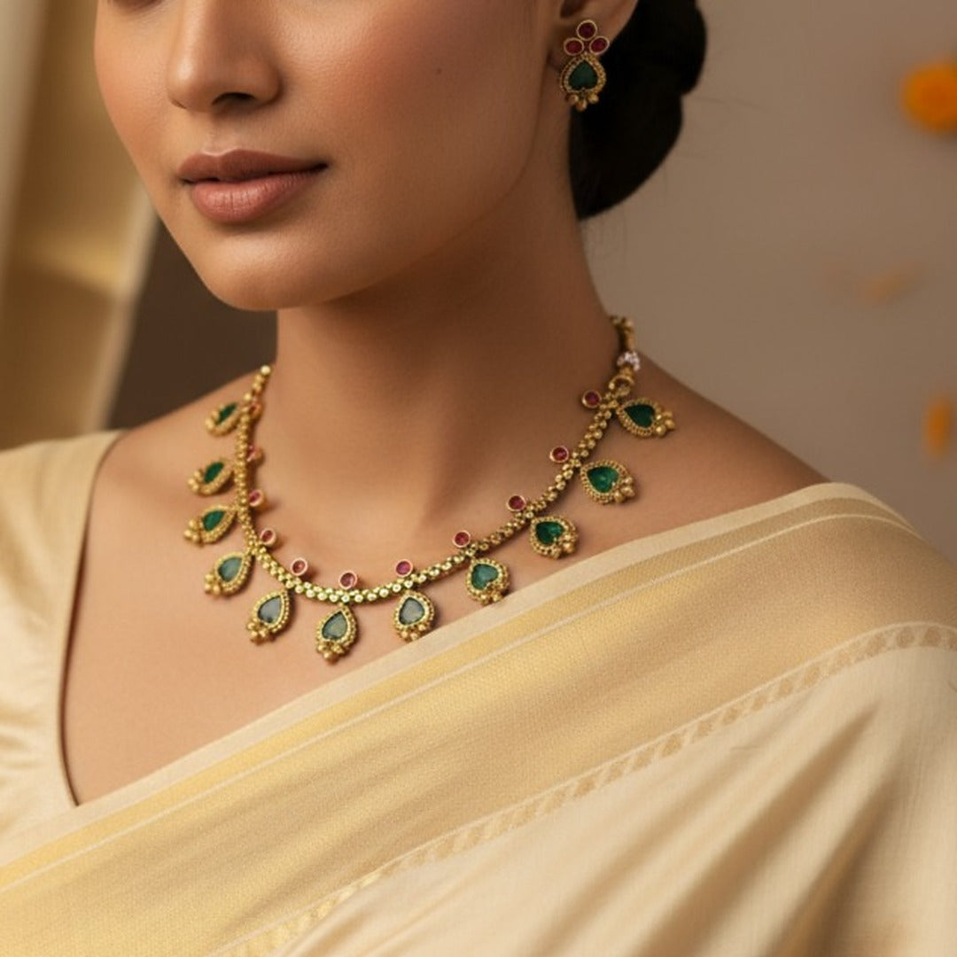 Kanaka: Gold Toned Stone Studded Necklace and Earring Set