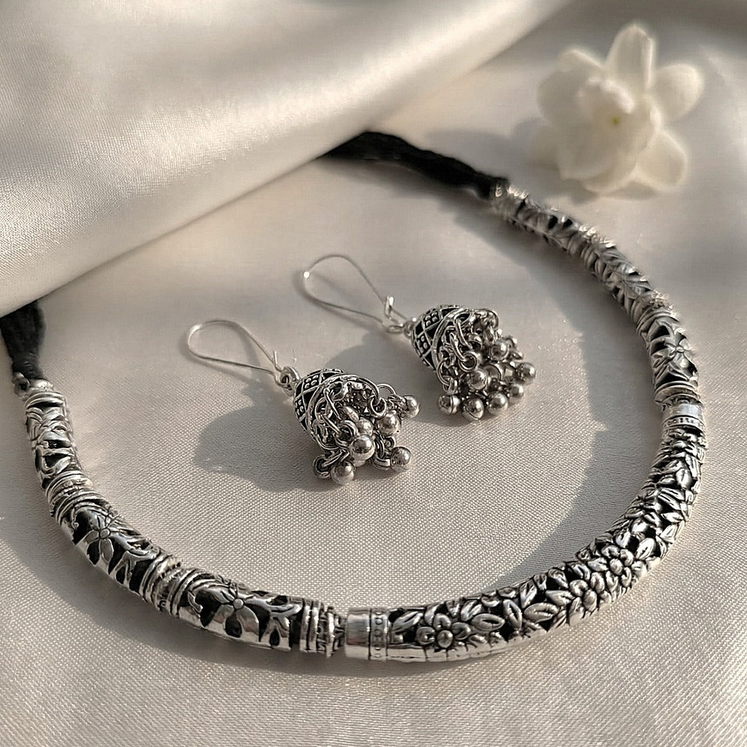 Vaibhava: Silver Toned Carved Hasli Set with Jhumkas