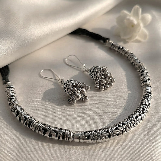 Vaibhava: Silver Toned Carved Hasli Set with Jhumkas