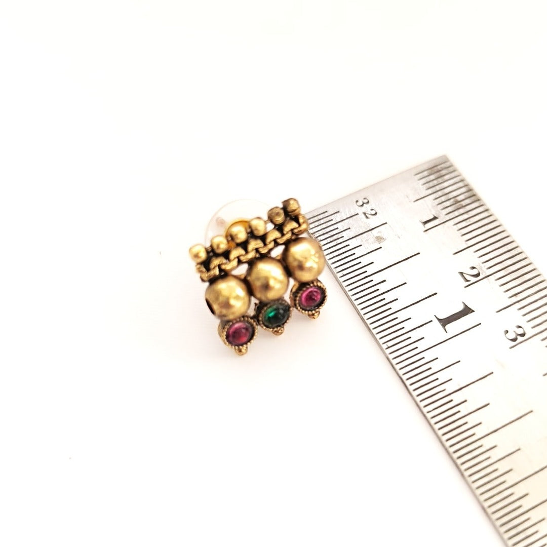 Tavisha: Antique Gold Toned Stone Studded Necklace and Earring Set