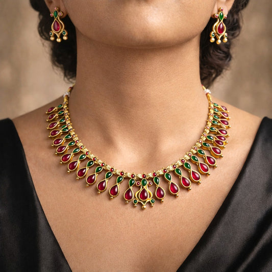 Varnika: Traditional Gold Toned Stone Studded Necklace and Earring Set