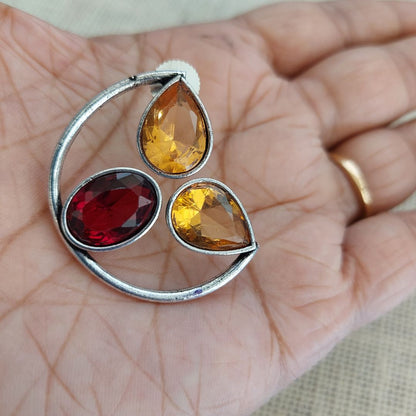 Sunset Symphony: Silver-Toned Ear Studs with Yellow and Red Stone"