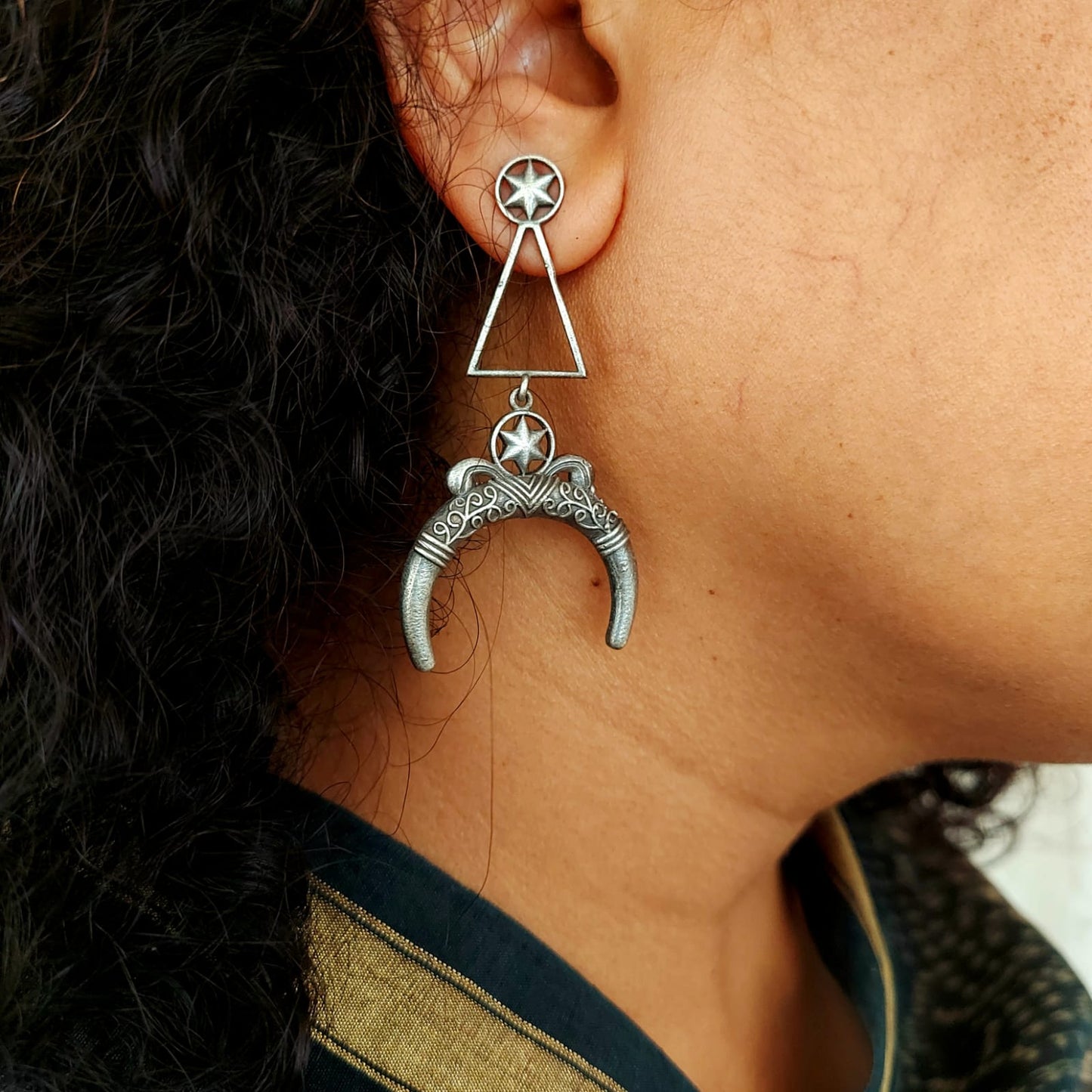 Silver look alike cresent design long earrings