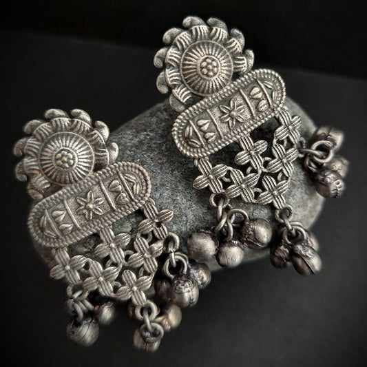 Silver look alike floral design earrings with ghungroo