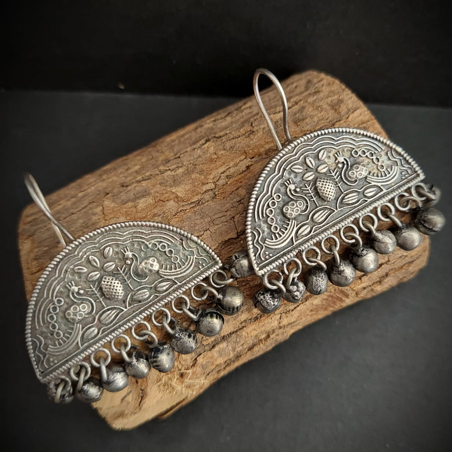 Silver look alike semi circular design hoop earrings